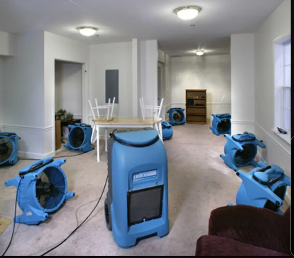 Air movers and dehumidifier setup for Water Damage Restoration in Forest Hills